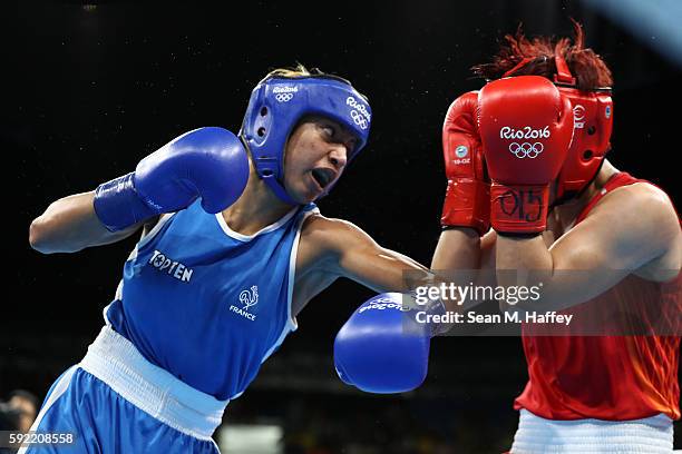 Estelle Mossely of France fights Junhua Yin of China in the Women's Light Final Bout on Day 14 of the Rio 2016 Olympic Games at the Riocentro arena...