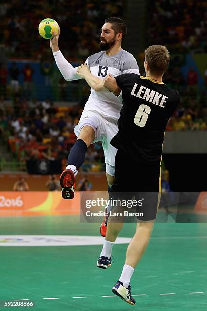 Nikola Karabatic of France jumps to take a shot during the Men's Handball Semifinal match between France and Germany on Day 14 of the Rio 2016...