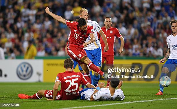 Robert Lewandowski of Munich scores the opening goal during the DFB Cup match between FC Carl Zeiss Jena and Bayern Muenchen at Ernst-Abbe-Sportfeld...