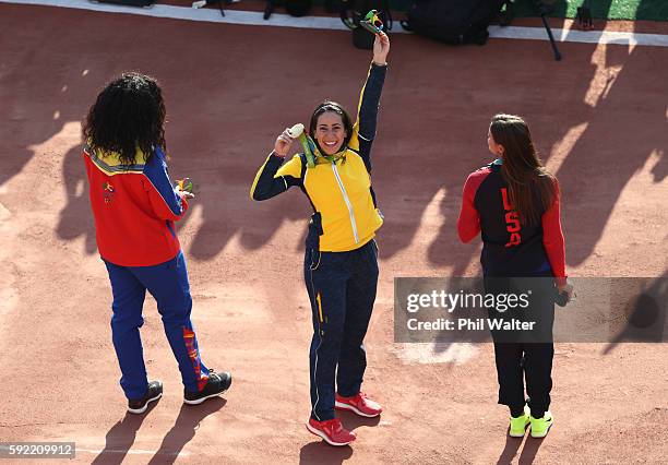 Mariana Pajon of Colombia celebrates on the podium after being presented with her gold medal after winning the Women's BMX Final on day 14 of the Rio...