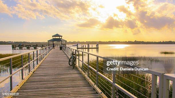 sunset at the pier - south carolina stock pictures, royalty-free photos & images