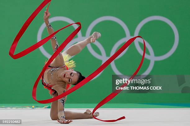 Germany's Jana Berezko-Marggrander competes in the individual all-around qualifying event of the Rhythmic Gymnastics at the Olympic Arena during the...