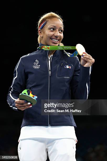Gold medalist Estelle Mossely of France celebrates on the podium after winning the Women's Light Final Bout Day 14 of the Rio 2016 Olympic Games at...