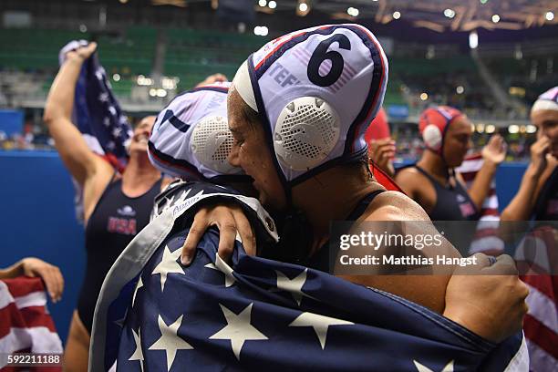 Courtney Mathewson of United States and Maggie Steffens of United States celebrate winning the Women's Water Polo Gold Medal match between the United...