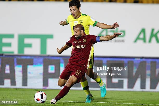 Gokdeniz Karadeniz of FC Rubin Kazan challenged by Shamil Gasanov of FC Anji Makhachkala during the Russian Premier League match between FC Rubin...