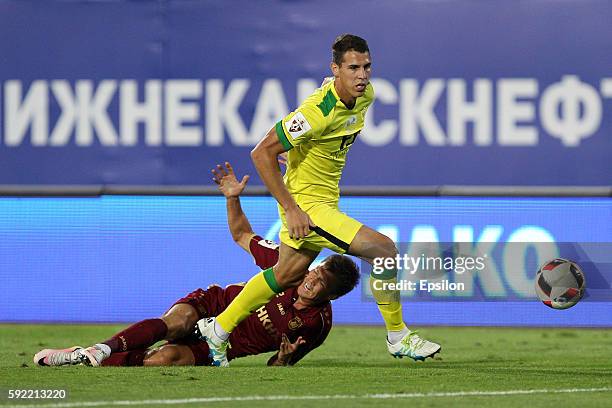 Maksim Kanunnikov of FC Rubin Kazan challenged by Darko Lazic of FC Anji Makhachkala during the Russian Premier League match between FC Rubin Kazan...