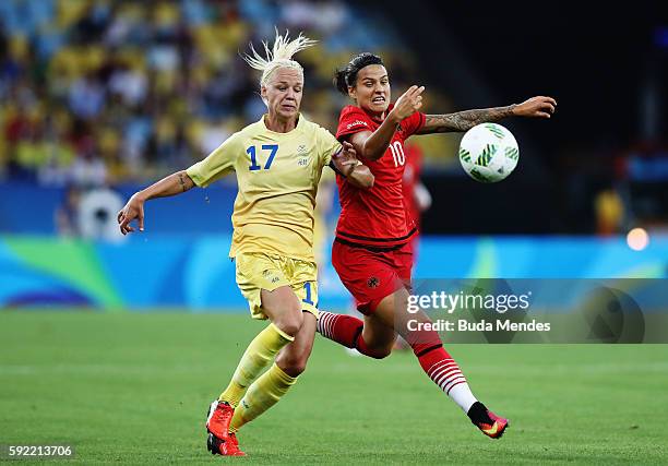 Caroline Seger of Sweden and Dzsenifer Marozsan of Germany challenge for the ball during the Women's Olympic Gold Medal match between Sweden and...