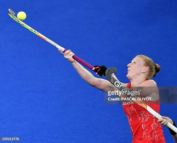 Britain's Nicola White hits the ball during the women's Gold medal hockey Netherlands vs Britain match of the Rio 2016 Olympics Games at the Olympic...