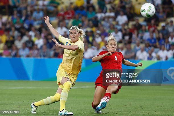 Sweden's striker Olivia Schough and Germany's defender Leonie Maier vie for the ball during the Rio 2016 Olympic Games women's football Gold medal...