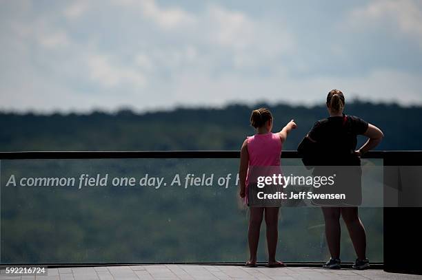 Visitors stroll through the Flight 93 National Memorial in Shanksville, Pennsylvania on August 19, 2016. American Airlines Flight 93 crashed into a...