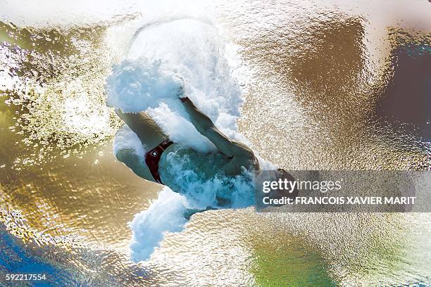 Picture taken with an underwater camera shows Canada's Maxim Bouchard competing in the Men's 10m Platform Preliminary during the diving event at the...