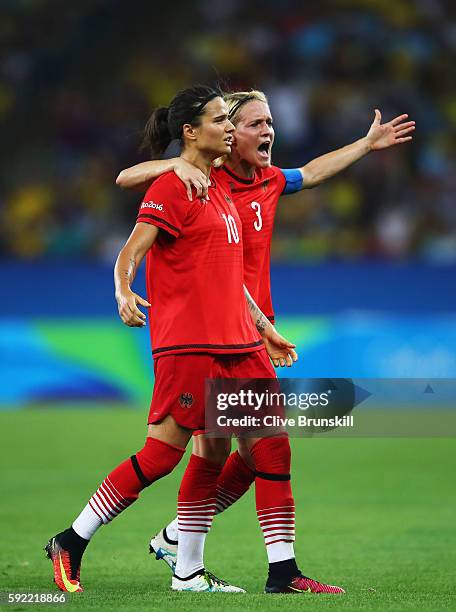 Dzsenifer Marozsan of Germany and Saskia Bartusiak of Germany celebrates after going 0-2 ahead during the Women's Olympic Gold Medal match between...
