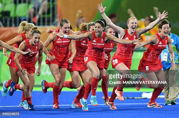 Britain's players celebrate their victory at the end of the women's Gold medal hockey Netherlands vs Britain match of the Rio 2016 Olympics Games at...