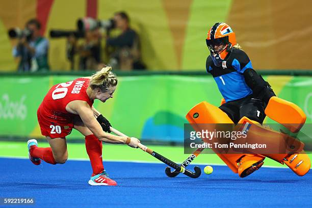 Hollie Webb of Great Britain scores the winning penalty past Joyce Sombroek of Netherlands during the Women's Gold Medal Match on Day 14 of the Rio...