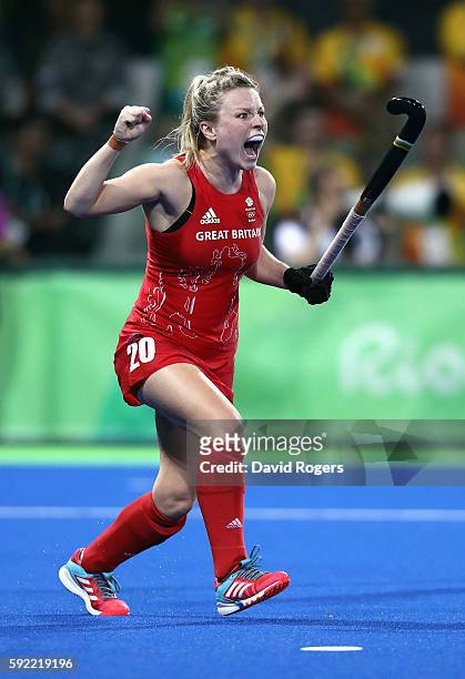 Hollie Webb of Great Britain celebrates after scoring the winning penalty against the Netherlands during the Women's Gold Medal Match on Day 14 of...