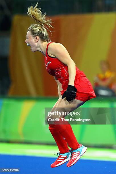 Hollie Webb of Great Britain celebrates after scoring the winning penalty against the Netherlands during the Women's Gold Medal Match on Day 14 of...