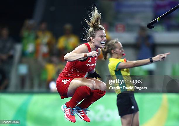 Hollie Webb of Great Britain celebrates after scoring the winning penalty against the Netherlands during the Women's Gold Medal Match on Day 14 of...