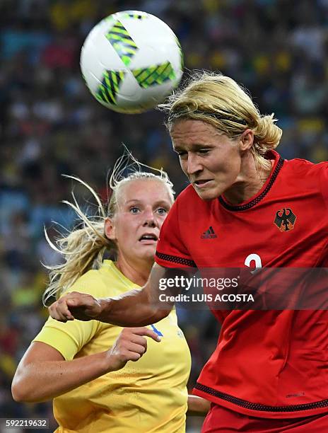 Sweden's striker Stina Blackstenius and Germany's defender and captain Saskia Bartusiak vie for the ball during the Rio 2016 Olympic Games women's...