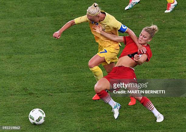 Sweden's midfielder Lisa Dahlkvist and Germany's defender Leonie Maier vie for the ball during the Rio 2016 Olympic Games women's football Gold medal...