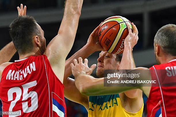 Serbia's power forward Milan Macvan and Serbia's power forward Milan Macvan hold off Australia's small forward Joe Ingles during a Men's semifinal...