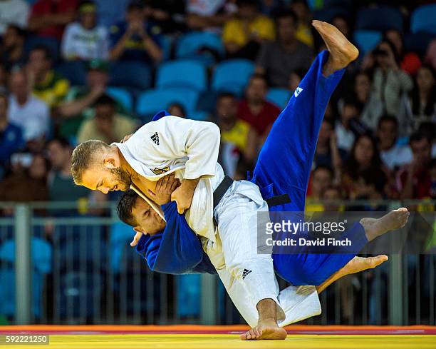 Karl-Richard Frey of Germany throws S Yan Niang Soe of Myanmar for an ippon as Frey advanced to the u100kg quarter-final during day 6 of the 2016 Rio...