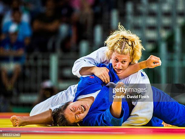 Kayla Harrison of the United States held Zhehui Zhang of China for an ippon in the morning session later advancing to her u78kg second gold medal...