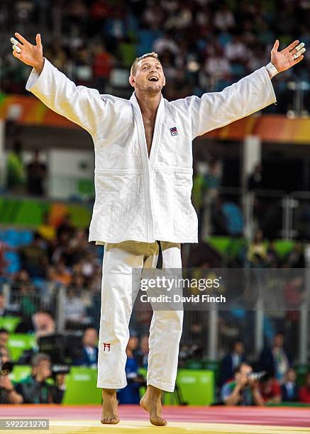 Lukas KrpÃ¡lek of the Czech Republic celebrates his narrow victory over Ryunosuke Haga of Japan as he progressed to the u100kg final where he won the...