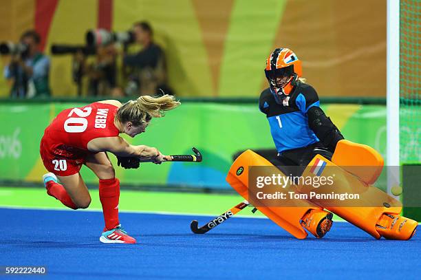 Hollie Webb of Great Britain scores the winning penalty goal past Joyce Sombroek of Netherlands during the Women's Gold Medal Match on Day 14 of the...