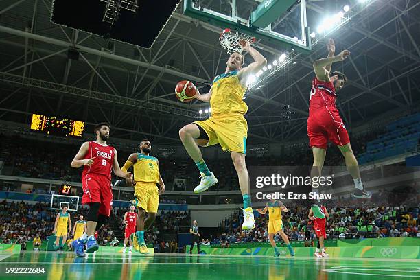 Joe Ingles of Australia slam dunks the ball against Serbia during the Men's Semifinal match on Day 14 of the Rio 2016 Olympic Games at Carioca Arena...