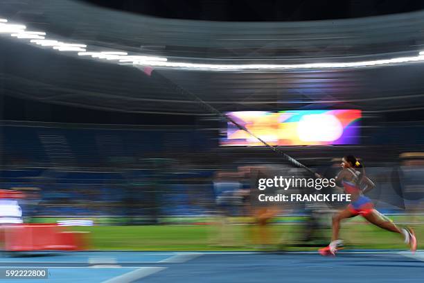 Cuba's Yarisley Silva warms up in the Women's Pole Vault Final during the athletics event at the Rio 2016 Olympic Games at the Olympic Stadium in Rio...