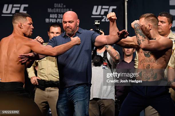 Opponents Nate Diaz and Conor McGregor of Ireland face off during the UFC 202 weigh-in at the MGM Grand Hotel & Casino on August 19, 2016 in Las...