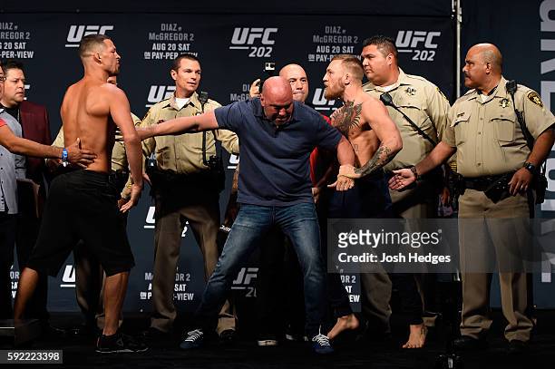 Opponents Nate Diaz and Conor McGregor of Ireland face off during the UFC 202 weigh-in at the MGM Grand Hotel & Casino on August 19, 2016 in Las...