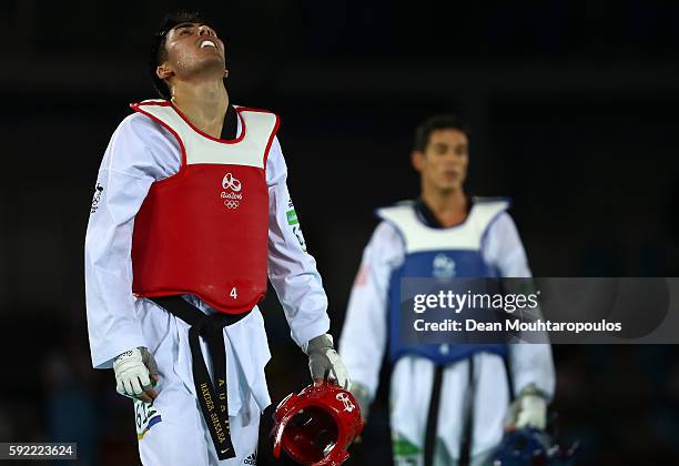 Hayder Shkara of Australia reacts in his Men's Taekwondo -80kg Repechage match against Steven Lopez of the United States on Day 14 of the Rio 2016...