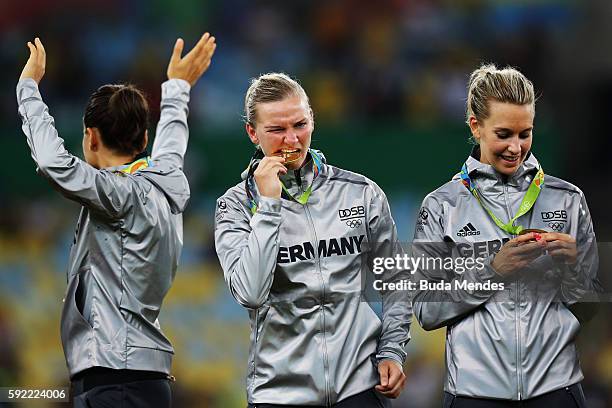 German players celebrate with their gold medals following victory during the Women's Olympic Gold Medal match between Sweden and Germany at Maracana...