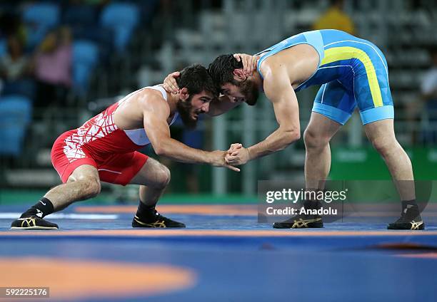 Soner Demirtas of Turkey competes against Galymzhan Usserbayev of Kazakhstan during the Men's 74kg Bronze Medal Wrestling match of the Rio 2016...