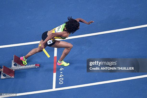 Jamaica's Christine Day competes in the Women's 4x400m Relay Round 1 during the athletics event at the Rio 2016 Olympic Games at the Olympic Stadium...