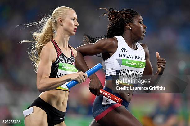 Sage Watson of Canada and Christine Ohuruogu of Great Britain compete in Round One of the Women's 4 x 400m Relay on Day 14 of the Rio 2016 Olympic...