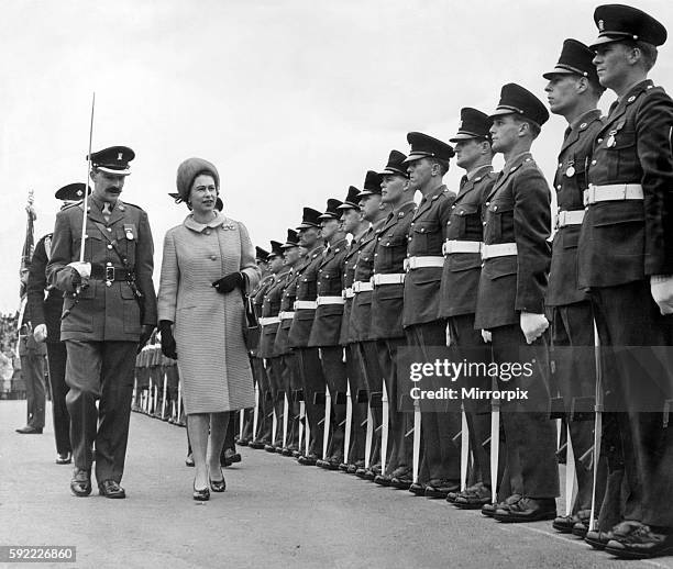 The Queen , accompanied by Major M Pim, inspects the Guard of Honour of the 1st Battalion of the South Wales Borderers 24th Regiment after her...