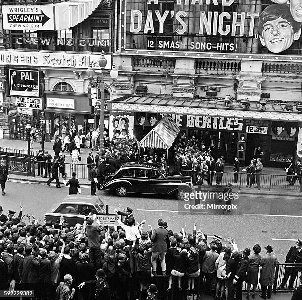 British group The Beatles arrive at the Pavilion Theatre for the premiere of musical comedy film A Hard Day's Night, London, UK, 6th July 1964.