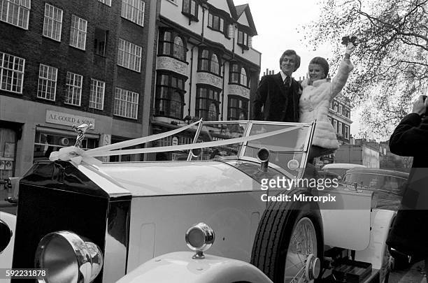 The bride wore a white mini dress and coat, and the couple drove off after the ceremony to a small lunch reception in a white 1923 Rolls Royce. The...