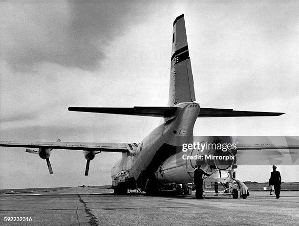 The rocket will be used shortly by the Americans to send another Discoverer satellite into orbit. The Thor being loaded into a Liftmaster transport...