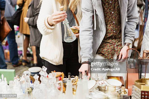 man and woman buying crockery at flea market - mid section bildbanksfoton och bilder