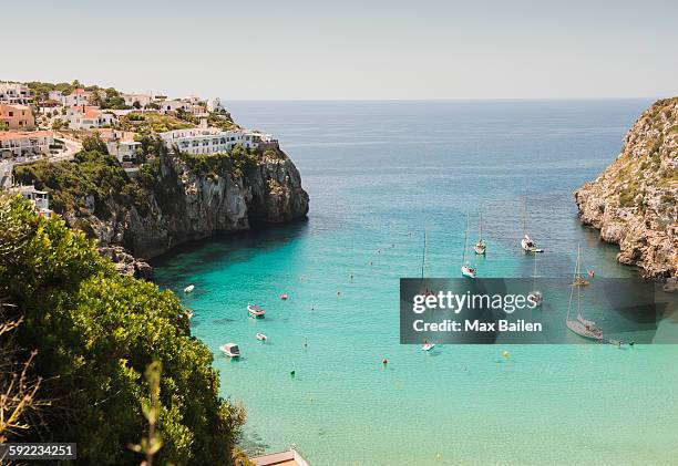 elevated view of two boats and yachts anchored in bay, menorca, balearic islands, spain - minorca stock pictures, royalty-free photos & images