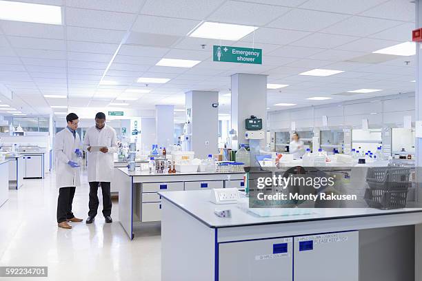 scientists working in testing laboratory, wide angle view - scientist at work stock pictures, royalty-free photos & images