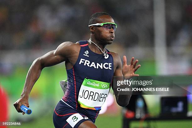 France's Thomas Jordier competes in the Men's 4x400m Relay Round 1 during the athletics event at the Rio 2016 Olympic Games at the Olympic Stadium in...