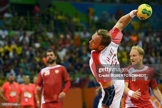 Denmark's pivot Rene Toft Hansen jumps to shoot during the men's semifinal handball match Poland vs Denmark for the Rio 2016 Olympics Games at the...