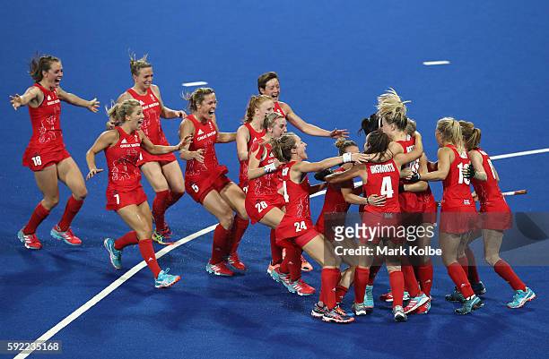 Great Britain players celebrate winning the shootout against Netherlands to win the Women's Gold Medal Match on Day 14 of the Rio 2016 Olympic Games...