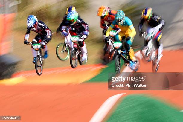 Corben Sharrah of the United States, Nicholas Long of the United States and Anthony Dean of Australia compete during the Men's BMX Semi Finals on day...