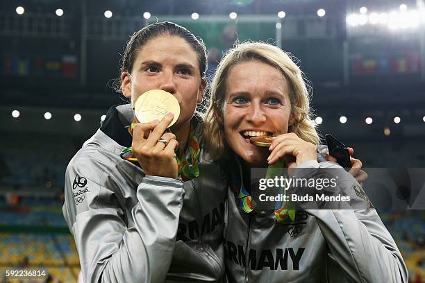 German team captain Saskia Bartusiak of Germany and Annike Krahn of Germany celebrate with their medals following victory in the Women's Olympic Gold...