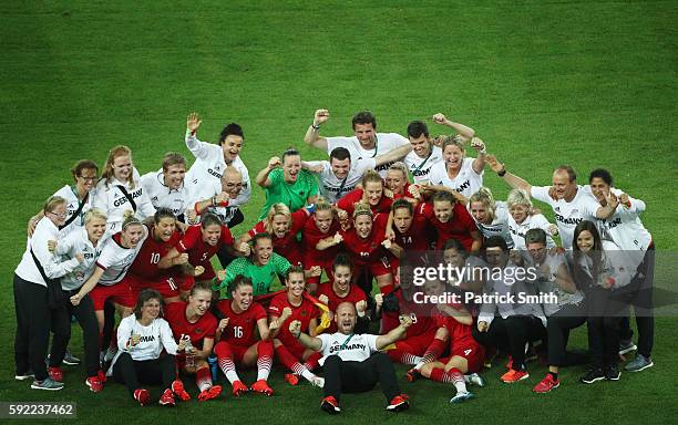 German players celebrate after the final whistle following victory during the Women's Olympic Gold Medal match between Sweden and Germany at Maracana...